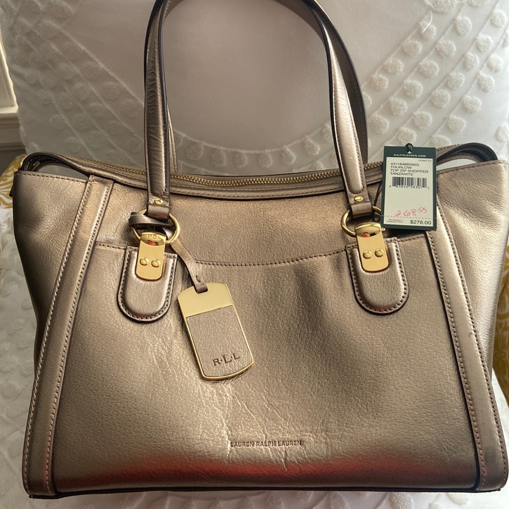 Ralph Lauren medium,light golden metallic color, approx. 11.5 X 9.5 X 9 cm.